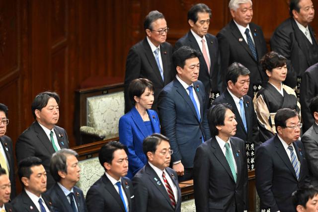 Japan's Prime Minister Sanae Takaichi (C) attends the House of Representatives plenary session at the Diet in Tokyo on January 23, 2026. Takaichi dissolved parliament ahead of a snap election on February 8, counting on her cabinet's high poll numbers to steer her otherwise unpopular ruling party to victory. (Photo by Kazuhiro NOGI / AFP)
