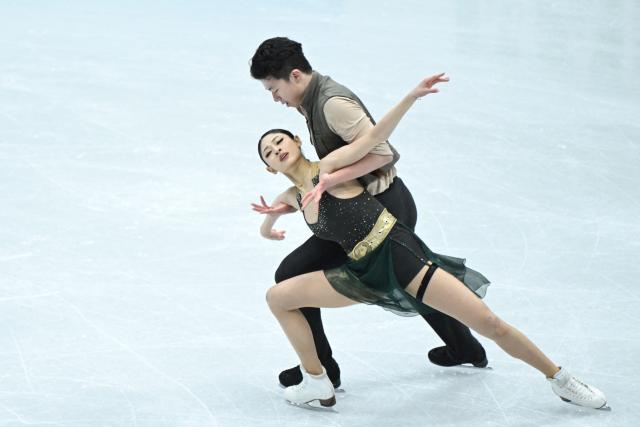 China’s Xiao Zixi and He Linghao perform in the ice dance free skating during the ISU figure skating Four Continents Championships 2026 in Beijing on January 23, 2026. (Photo by WANG Zhao / AFP)