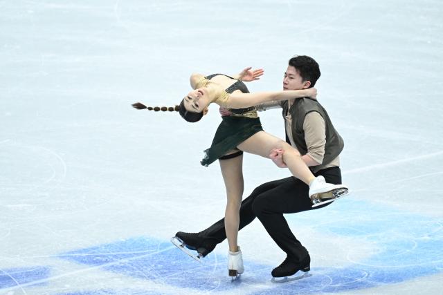China’s Xiao Zixi and He Linghao perform in the ice dance free skating during the ISU figure skating Four Continents Championships 2026 in Beijing on January 23, 2026. (Photo by WANG Zhao / AFP)