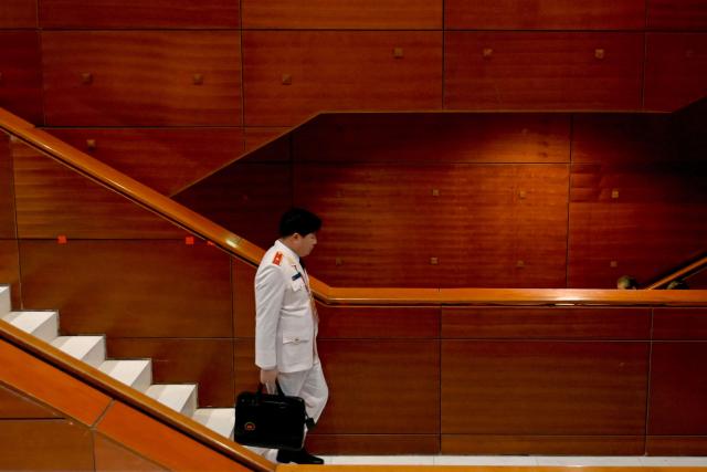 A delegate arrives to attend the closing ceremony of the 14th National Congress of the Communist Party of Vietnam at the National Convention Centre in Hanoi on January 23,2026. (Photo by Nhac NGUYEN / AFP)