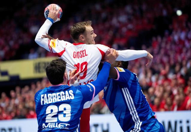 Denmark's right back #19 Mathias Gidsel vies with France's pivot #23 Ludovic Fabregas during the men's EHF Euro 2026 main round handball match France vs Denmark in Herning, Denmark, on January 22, 2026. (Photo by Bo Amstrup / Ritzau Scanpix / AFP) / Denmark OUT