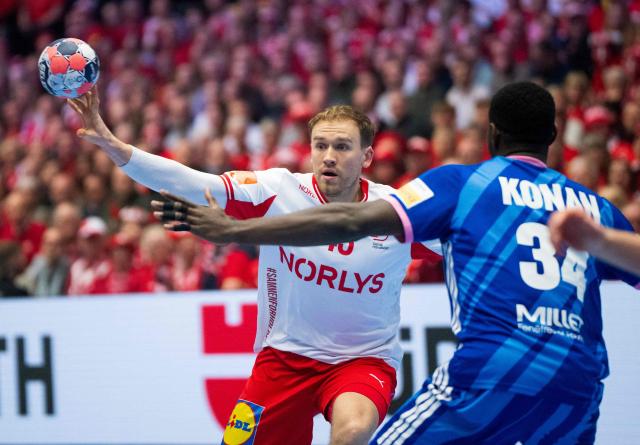 Denmark's centre back #43 Simon Pytlick and France's pivot #34 Karl Konan vie for the ball during the men's EHF Euro 2026 main round handball match France vs Denmark in Herning, Denmark, on January 22, 2026. (Photo by Bo Amstrup / Ritzau Scanpix / AFP) / Denmark OUT