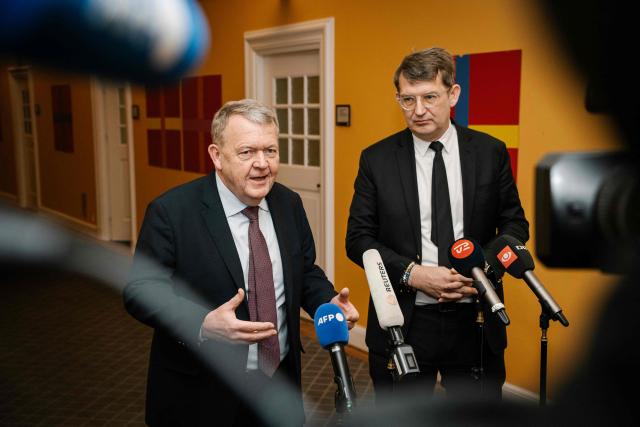 Danish Foreign Minister Lars Loekke Rasmussen (L) and Danish Defense Minister Troels Lund Poulsen addresses journalists at a doorstep after a meeting of the Foreign Policy Committee at Christiansborg in Copenhagen, Denmark, on January 23, 2026. On the agenda is Denmark's relationship with the US. (Photo by Emil Nicolai Helms / Ritzau Scanpix / AFP) / Denmark OUT