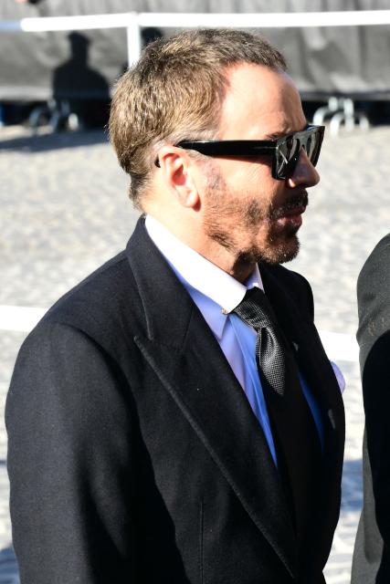US fashion designer Tom Ford arrives at the funeral ceremony for the late Italian fashion designer Valentino Gavarani at the Basilic of Santa Maria degli Angeli e dei Martiri, in Rome on January 23, 2026. (Photo by Stefano RELLANDINI / AFP)