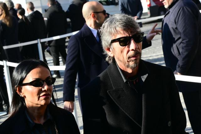 Italian fashion designer Pier Paolo Piccioli (R) arrives at the funeral ceremony for the late Italian fashion designer Valentino Gavarani at the Basilic of Santa Maria degli Angeli e dei Martiri, in Rome on January 23, 2026. (Photo by Stefano RELLANDINI / AFP)