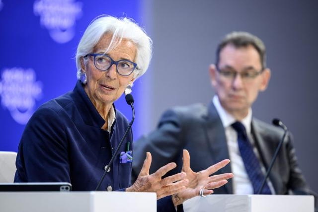 European Central Bank (ECB) president Christine Lagarde (L) speaks next to Pfizer Chairman and CEO Albert Bourla during the final day of the World Economic Forum (WEF) annual meeting in Davos on January 23, 2026. (Photo by Fabrice COFFRINI / AFP)