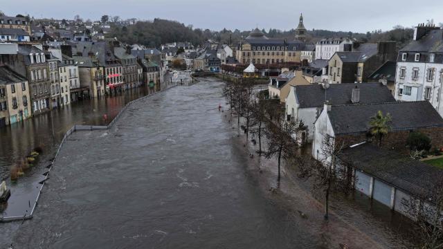 This aerial photograph shows streets in the city center street flooded by the Laita river in Quimperle, western France on January 23, 2026. (Photo by Damien MEYER / AFP)