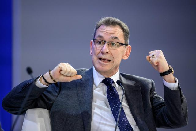 Pfizer chairman and CEO Albert Bourla gestures as he speaks during the final day of the World Economic Forum (WEF) annual meeting in Davos on January 23, 2026. (Photo by Fabrice COFFRINI / AFP)
