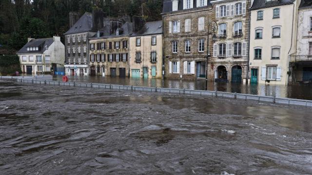 This aerial photograph shows streets in the city center street flooded by the Laita river in Quimperle, western France on January 23, 2026. (Photo by Damien MEYER / AFP)