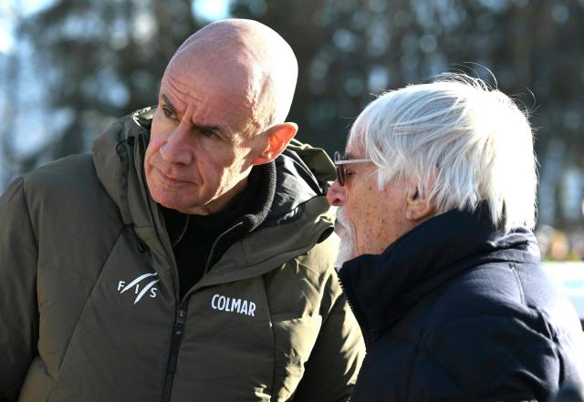 Formula One legend Bernie Ecclestone (R) and the President of the International Ski Federation (FIS) are pictured during the Men's Super-G event of the FIS Alpine Skiing World Cup in Kitzbuehel, Austria, on January 23, 2026. (Photo by BARBARA GINDL / APA / AFP) / Austria OUT