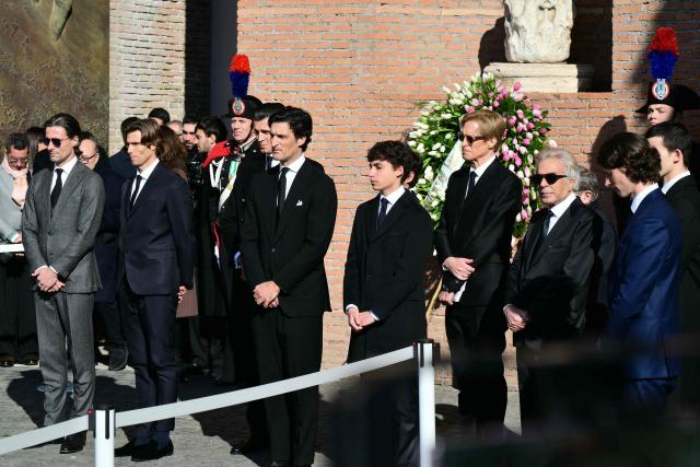 Relatives, Italian businessman Giancarlo Giammetti (3rd R) and Vernon Bruce Hoeksema (4th R) leave the Basilic of Santa Maria degli Angeli e dei Martiri after a funeral ceremony  for the late Italian fashion designer Valentino Gavarani, in Rome on January 23, 2026. (Photo by Stefano RELLANDINI / AFP)