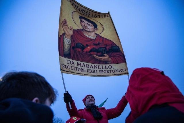 A fan waves a banner bearing the picture of Monaco's driver Charles Leclerc before the test of the new Formula 1 Ferrari SF-26 at Fiorano Circuit in Fiorano Modenese, on January 23, 2026. (Photo by Federico SCOPPA / AFP)