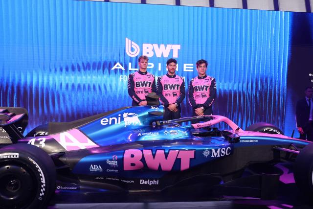 (From L) Alpine's Estonian test and reserve driver Paul Aron, Alpine's French driver Pierre Gasly and Alpine's Argentinian driver Franco Colapinto pose on stage next to the Alpine F1 new car during the presentation of Alpine season on January 23, 2026 in Barcelona. (Photo by Josep LAGO / AFP)