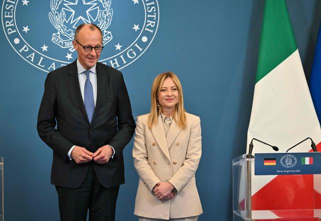 Italy's Prime Minister Giorgia Meloni and Germany's Chancellor Friedrich Merz arrive to sign bilateral agreements on strategic cooperation after an Intergovernmental summit between Italy and Germany, at Villa Doria Pamphilj in Rome on January 23, 2026. (Photo by Andreas SOLARO / AFP)