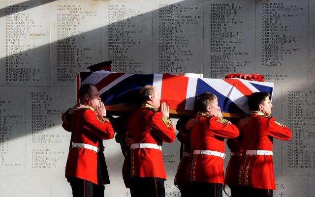 (FILES) The coffin of Darren Chant, Regimental Sergeant Major, 1st Battalion Grenadier Guards, is carried out of the Royal Military Chapel at Wellington Barracks in London, on December 1, 2009. Warrant Officer Darren Chant spent more than 20 years in the Army but was killed with four other British soldiers in an incident at a police checkpoint in Nad e-Ali, Afghanistan on November 3. Britain said Donald Trump was "wrong to diminish" the role of NATO troops in Afghanistan, as a claim by the US president that they did not fight on the front line sparked outrage. In an interview with Fox News aired on Thursday, January 22, 2026, Trump appeared unaware that 457 British soldiers died during the conflict in the South Asian country following the September 11 attacks on the United States. (Photo by Adrian DENNIS / AFP)