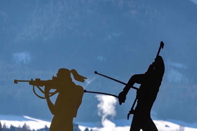 Figurines of biathletes are seen at the entrance to the village of Antholz, northern Italy, the venue for the Olympic Biathlon competitions of the Milano Cortina 2026 Olympic Games, on January 23, 2026. (Photo by Odd ANDERSEN / AFP)