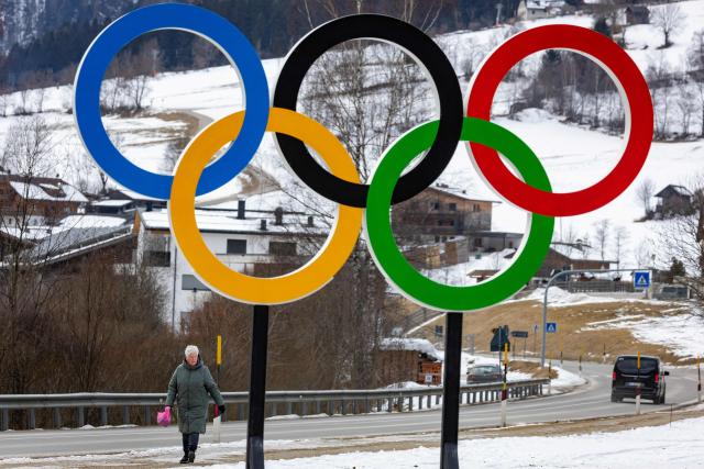 The Olympic rings are seen along a road leading to the Biathlon venue in Antholz, northern Italy, prior to the Milano Cortina 2026 Olympic Games, on January 23, 2026. (Photo by Odd ANDERSEN / AFP)