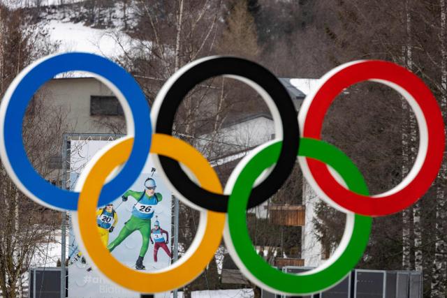 The Olympic rings are seen along a road leading to the Biathlon venue in Antholz, northern Italy, prior to the Milano Cortina 2026 Olympic Games, on January 23, 2026. (Photo by Odd ANDERSEN / AFP)