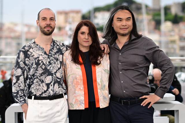 (FILES) French writer Eddine Noel, French director and screenwriter Mailys Vallade and Director Liane-Cho Han pose during a photocall for the film "Amйlie et la Mйtaphysique des tubes" (Little Amйlie or the Character of Rain) at the 78th edition of the Cannes Film Festival in Cannes, southern France, on May 20, 2025.lls, California, on December 3, 2025. Two independent productions take on giants Netflix and Disney: with Oscar nominations for ‘Arco’ and ‘Amйlie et la mйtaphysique des tubes’, French animation has scored twice and proven its vitality, despite the threat of AI. (Photo by Miguel MEDINA / AFP)