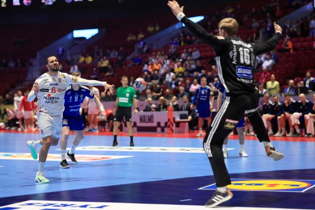 Croatia's right winger #06 Mario Sostaric (L) shoots the ball during the men's EHF Euro 2026 main round handball match Iceland v Croatia in Malmoe, Sweden, on January 23, 2026. (Photo by Andreas Hillergren/TT / TT NEWS AGENCY / AFP) / Sweden OUT