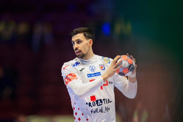Croatia's right back #51 Ivan Martinovic plays the ball during the men's EHF Euro 2026 main round handball match Iceland v Croatia in Malmoe, Sweden, on January 23, 2026. (Photo by Andreas Hillergren/TT / TT NEWS AGENCY / AFP) / Sweden OUT