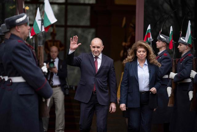Outgoing Bulgaria's President Rumen Radev (L) walks out from the Bulgarian Presidency parade entrance with the incoming President and former Vice President Iliana Iotova in Sofia on January 23, 2026. Bulgaria's president announced his resignation on January 19, 2026, ahead of snap elections expected in spring, deepening political turmoil in the EU and NATO member. (Photo by Nikolay DOYCHINOV / AFP)