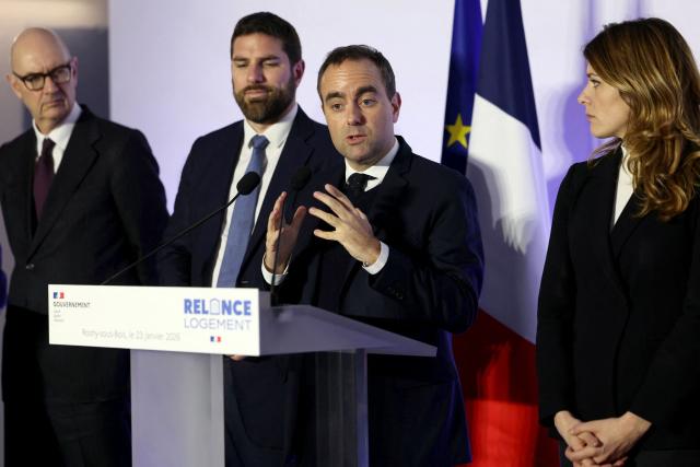 France's Prime Minister Sebastien Lecornu (2nd R) speaks as he is flanked by France's Economy and Finance Minister Roland Lescure (L), France's Housing Minister Vincent Jeanbrun (2nd L) and France's Government Spokesperson Maud Bregeon (R) gestures during his visit to a housing project in Rosny-sous-Bois, in the suburb of Paris on January 23, 2026. (Photo by Thomas SAMSON / AFP)