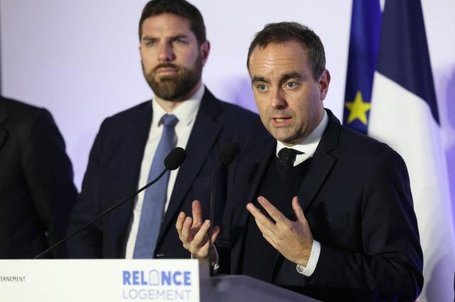 France's Prime Minister Sebastien Lecornu (R) speaks as he is flanked by France's Housing Minister Vincent Jeanbrun during his visit to a housing project in Rosny-sous-Bois, in the suburb of Paris on January 23, 2026. (Photo by Thomas SAMSON / AFP)