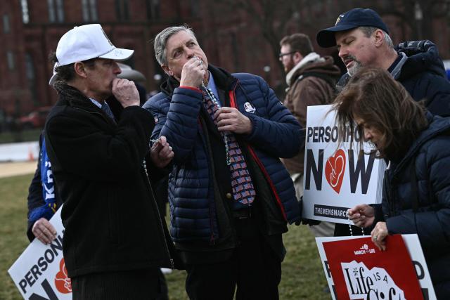 People hold rosaries as they pray the hail Mary during the 53rd annual March for Life rally on the National Mall in Washington, DC, on January 23, 2026. The annual pro-life demonstration, themed "Life is a Gift," marks the anniversary of the Roe v. Wade decision and includes a march toward Capitol Hill. (Photo by Brendan SMIALOWSKI / AFP)