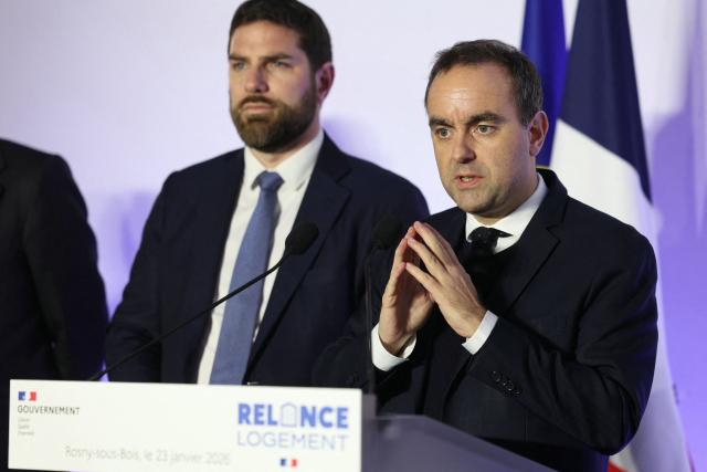 France's Prime Minister Sebastien Lecornu (R) speaks as he is flanked by France's Housing Minister Vincent Jeanbrun during his visit to a housing project in Rosny-sous-Bois, in the suburb of Paris on January 23, 2026. (Photo by Thomas SAMSON / AFP)