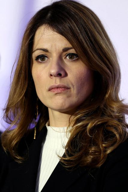 France's Government Spokesperson Maud Bregeon listens to the speech of France's Housing Minister during a visit to a housing project in Rosny-sous-Bois, in the suburb of Paris on January 23, 2026. (Photo by Thomas SAMSON / AFP)