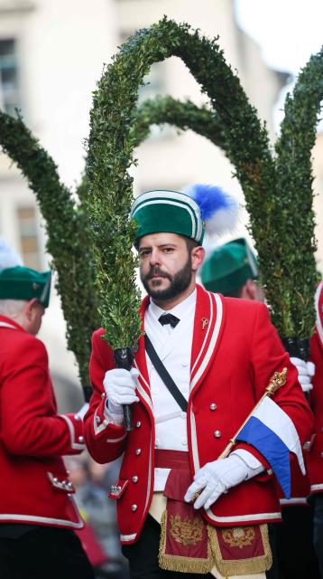 Members of the Munich Coopers' association dance the traditional Schaefflertanz (coopers’ dance) in front of the old Town Hall tower at Marienplatz in Munich, southern Germany on January 23, 2026. The Schaeffler perform their historic dance only every seven years. Until Shrove Tuesday on February 17, 2026, they will appear again in Munich’s public squares. Their traditional round dance, dating back to 1517 when coopers are said to have lifted spirits after a plague, follows a centuries-old choreography and is still performed in seven-year intervals according to an old oath. (Photo by ALEXANDRA BEIER / AFP)
