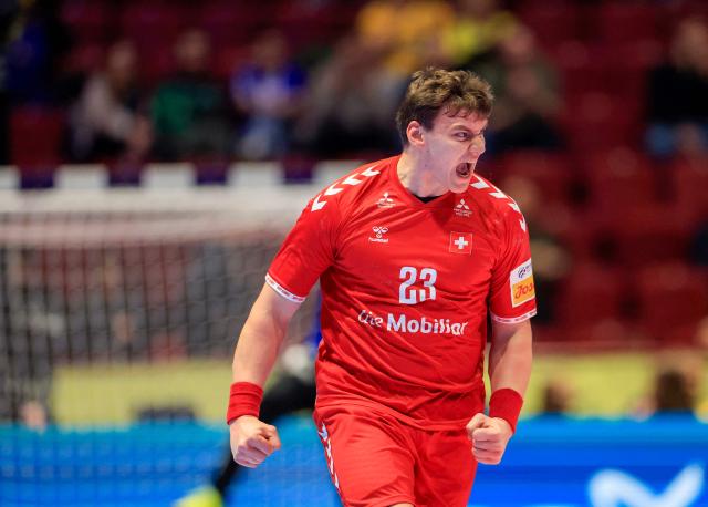 Switzerland's pivot #23 Lukas Laube reacts during the men's EHF Euro 2026 main round handball match Switzerland v Hungary in Malmoe, Sweden, on January 23, 2026. (Photo by Andreas Hillergren/TT / various sources / AFP) / Sweden OUT
