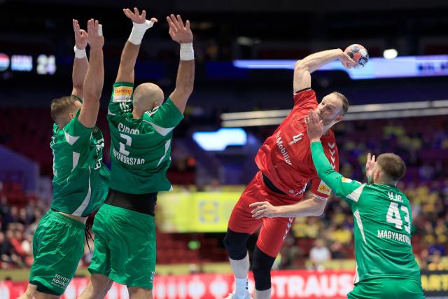 Switzerland's left back #04 Lenny Rubin shoots during the men's EHF Euro 2026 main round handball match Switzerland v Hungary in Malmoe, Sweden, on January 23, 2026. (Photo by Andreas Hillergren/TT / various sources / AFP) / Sweden OUT