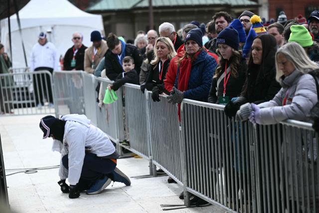People bow their heads in prayer as they attend the 53rd annual March for Life rally on the National Mall in Washington, DC, on January 23, 2026. The annual pro-life demonstration, themed "Life is a Gift," marks the anniversary of the Roe v. Wade decision and includes a march toward Capitol Hill. (Photo by Brendan SMIALOWSKI / AFP)