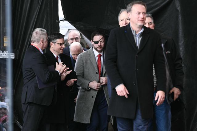 US Speaker of the House Mike Johnson (2L), Republican from Louisiana and US Representative Dan Crenshaw (C), Republican of Texas arrive onstage during the 53rd annual March for Life rally on the National Mall in Washington, DC, on January 23, 2026. The annual pro-life demonstration, themed "Life is a Gift," marks the anniversary of the Roe v. Wade decision and includes a march toward Capitol Hill. (Photo by Brendan SMIALOWSKI / AFP)