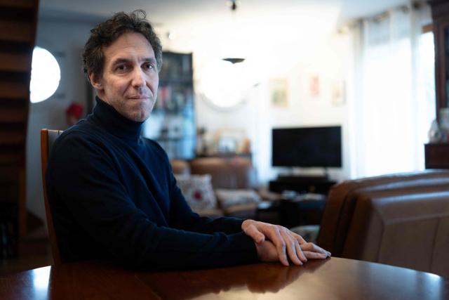French researcher Laurent Vinatier, who was arrested in Russia in June 2024 and released in January 2026, poses in his family house in Issy-les-Moulineaux on January 23, 2026. French researcher Laurent Vinatier arrived in France on January 8, 2026 following a prisoner exchange involving a Russian basketball player wanted in the United States. (Photo by JOEL SAGET / AFP)
