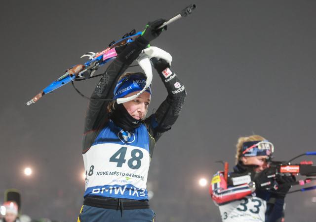 Germany's Franziska Preuss (L) competes next to Norway's Siri Skar on the shooting range of the women's 12,5 km short individual event of the IBU Biathlon World Cup in Nove Mesto, Czech Republic, on January 23, 2026. (Photo by Radek Mi?a / AFP)