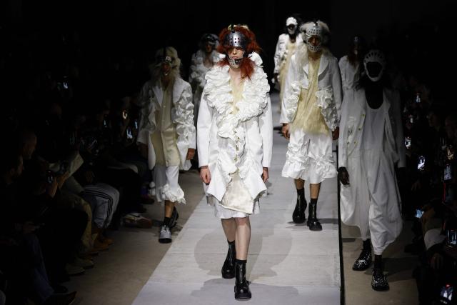 Models present creations by Comme des Garcons Homme Plus for the Menswear Ready-to-wear Fall-Winter 2026/2027 collection as part of the Men Paris Fashion Week in Paris on January 23, 2026.  (Photo by Ian LANGSDON / AFP)