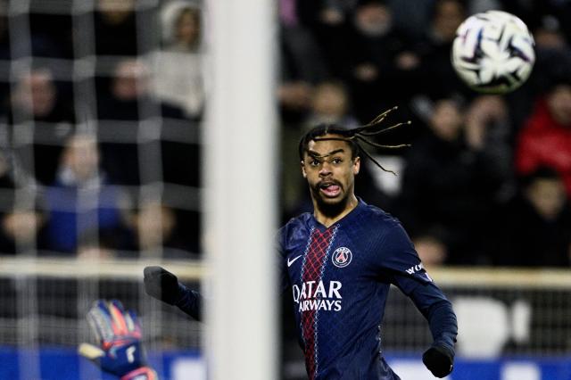 Paris Saint-Germain's French forward #29 Bradley Barcola eyes the ball during the French L1 football match between  AJ Auxerre and Paris Saint-Germain (PSG) at Stade de l'Abbe-Deschamps in Auxerre on January 23, 2026. (Photo by JULIEN DE ROSA / AFP)