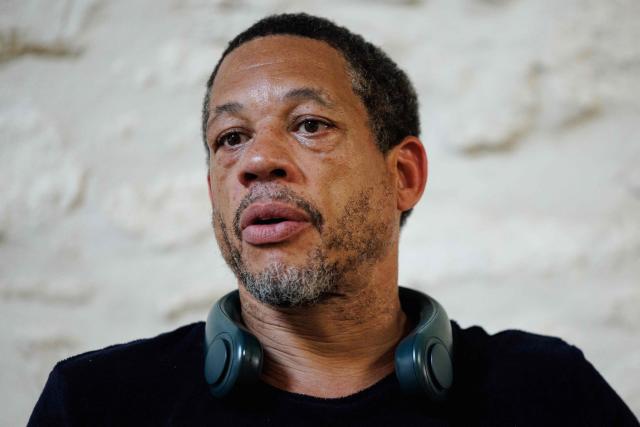 (FILES) French actor Didier Morville, aka JoeyStarr, poses for a photo session in the "Theatre du Balcon", in Avignon, southern France, on July 10, 2023. French rapper JoeyStarr and his longtime manager Sebastien Farran faced each other in court on January 23, 2026, over accusations Farran defrauded his client in the mid-2010s in the handling of his affairs. (Photo by CLEMENT MAHOUDEAU / AFP)