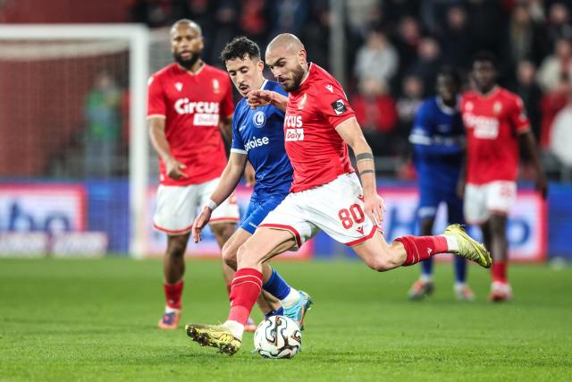 KAA Gent's Algerian midfielder #00 Abdelkahar Kadri (L)  fights for the ball with Standard's Maltese midfielder #10 Teddy Teuma during the Belgian Pro League football match between Standard de Liege and KAA Gent at the Maurice Dufrasne Stadium in Liege, on January 23, 2026. (Photo by BRUNO FAHY / Belga / AFP) / Belgium OUT