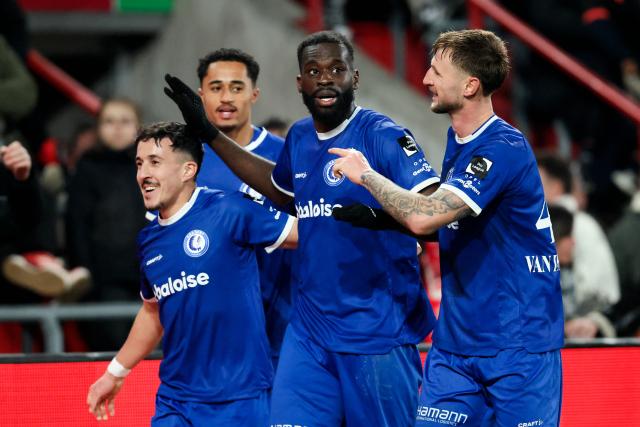 Gent's Wilfried Kanga celebrates with teammates after scoring a goal during the Belgian Pro League football match between Standard de Liege and KAA Gent at the Maurice Dufrasne Stadium in Liege, on January 23, 2026. (Photo by BRUNO FAHY / Belga / AFP) / Belgium OUT