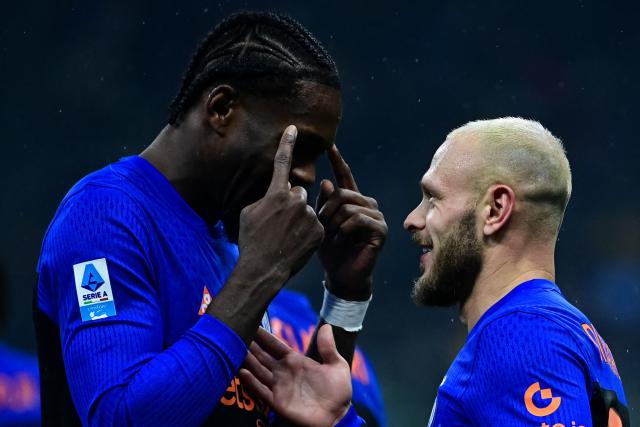 Inter Milan's Italian defender #32 Federico Dimarco  (R) celebrates with Inter Milan's French forward #09 Marcus Thuram after scoring his team fourth goal during the Italian Serie A football match between Inter Milan and Pisa at the San Siro Stadium in Milan on January 23, 2026. (Photo by Piero CRUCIATTI / AFP)