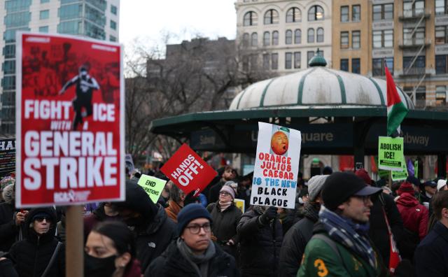 People hold anti-Trump signs as they march in an "ICE Out" protest in New York on January 23, 2026 against US Immigration and Customs Enforcement (ICE). Demonstrations against ICE grew dramatically following the killing of Renee Nicole Good, 37, by an ICE officer in Minneapolis on January 7 as the Trump administration pressed operations to catch undocumented migrants. (Photo by ANGELA WEISS / AFP)