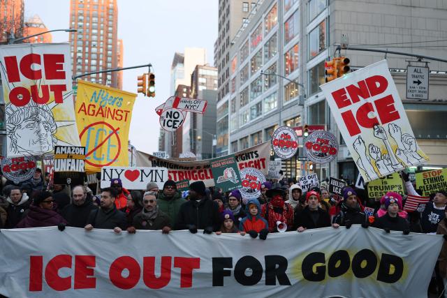 People hold banners and signs as they march in an "ICE Out" protest in New York on January 22, 2026 against US Immigration and Customs Enforcement (ICE). Demonstrations against ICE grew dramatically following the killing of Renee Nicole Good, 37, by an ICE officer in Minneapolis on January 7 as the Trump administration pressed operations to catch undocumented migrants. (Photo by ANGELA WEISS / AFP)