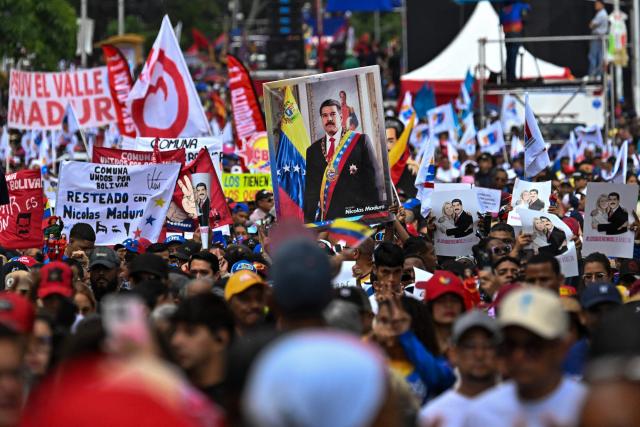 A portrait of ousted Venezuelan President Nicolas Maduro is seen during a demonstration by supporters calling for the release of him and his wife from a US prison in Caracas on January 23, 2026. Thousands of Nicolas Maduro's supporters marched in Caracas on January 23, calling for the release of the ousted president, as Venezuela marked the 68th anniversary of the fall of military dictatorship. (Photo by Juan BARRETO / AFP)