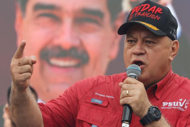 Venezuela's Minister of the Interior and Justice, Diosdado Cabello, gestures as he speaks during a demonstration by supporters of ousted President Nicolas Maduro calling for the release of him and his wife from a US prison in Caracas on January 23, 2026. Thousands of Nicolas Maduro's supporters marched in Caracas on January 23, calling for the release of the ousted president, as Venezuela marked the 68th anniversary of the fall of military dictatorship. (Photo by Pedro MATTEY / AFP)