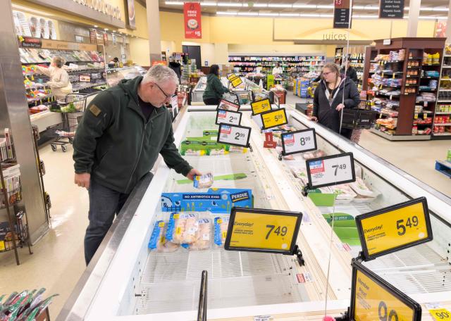 Near empty poultry shelves are seen as residents stock up on supplies ahead of a cold front expected in the area in Arlington, Virginia, on January 23, 2026. A massive winter storm was set to drop a mix of freezing rain and heavy snow on some 160 million Americans starting January 23, threatening to bring dangerously icy conditions. Multiple US states declared states of emergency as meteorologists said the storm would soon begin marching across much of the continental US, covering a wide swath of the country's middle including the Rockies and Plains. (Photo by SAUL LOEB / AFP)