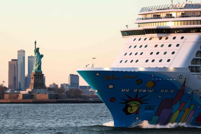 The Norwegian Breakaway of Norwegian Cruise Line passes by the Statue of Liberty after departing from New York on January 23, 2026. (Photo by CHARLY TRIBALLEAU / AFP)
